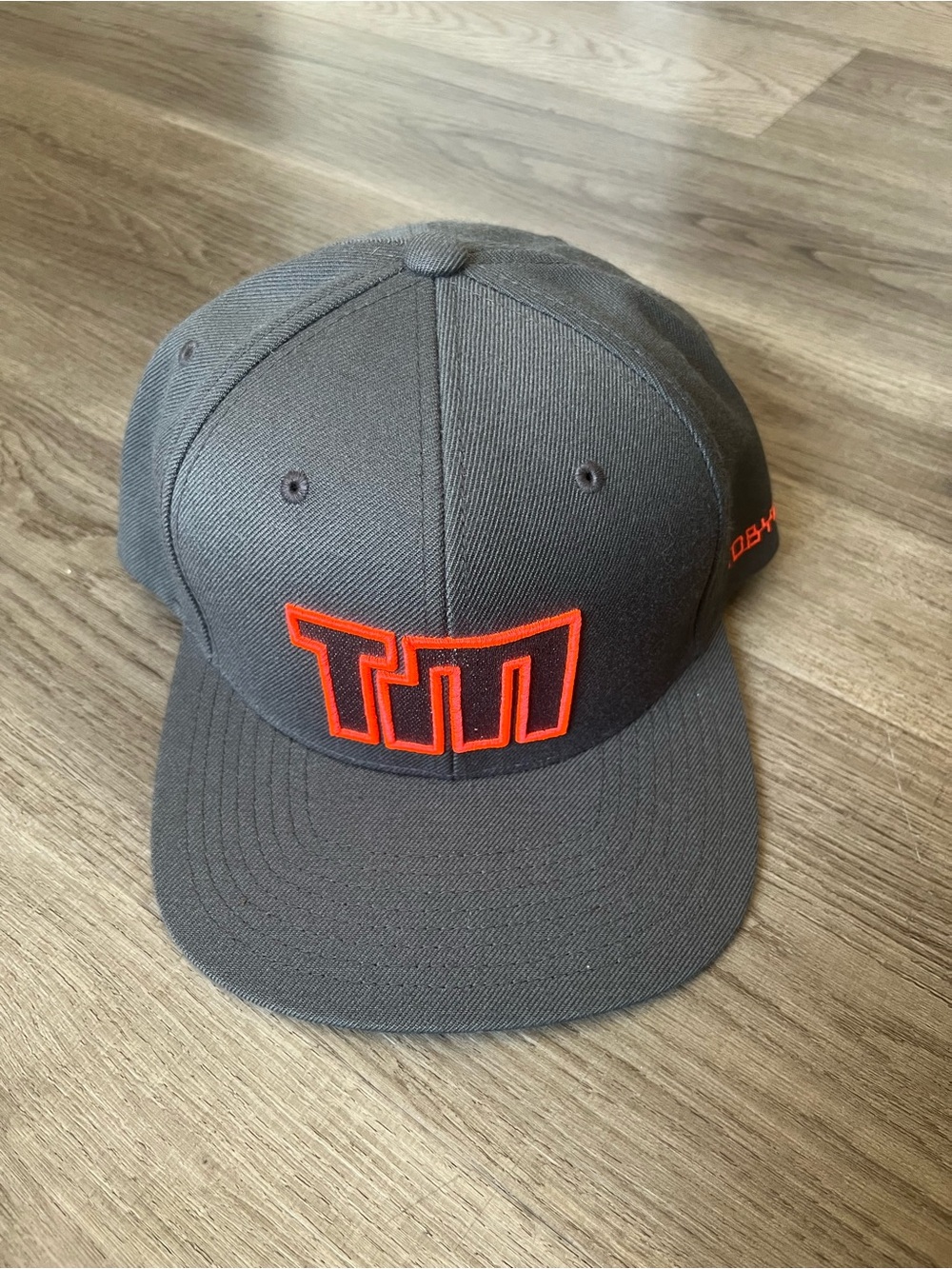 TobyMac TM Embroidered Grey Snapback Cap with Orange Logo